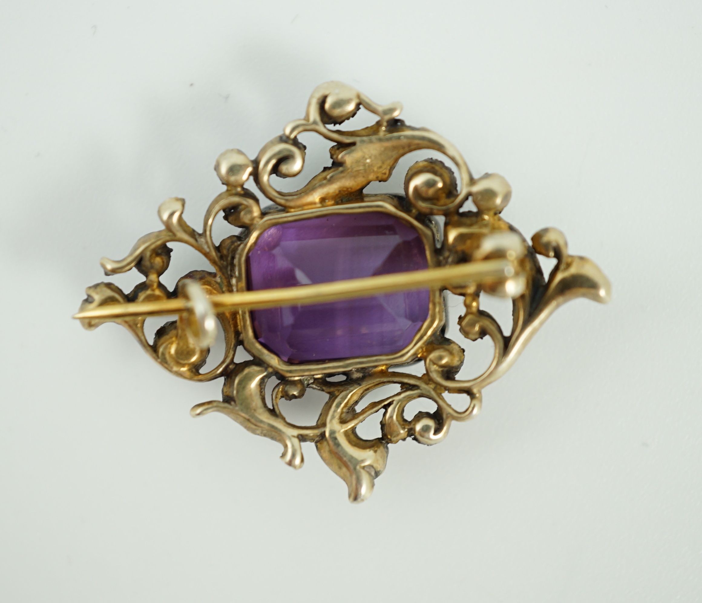 A Victorian gold and silver, emerald cut amethyst and diamond cluster set brooch
